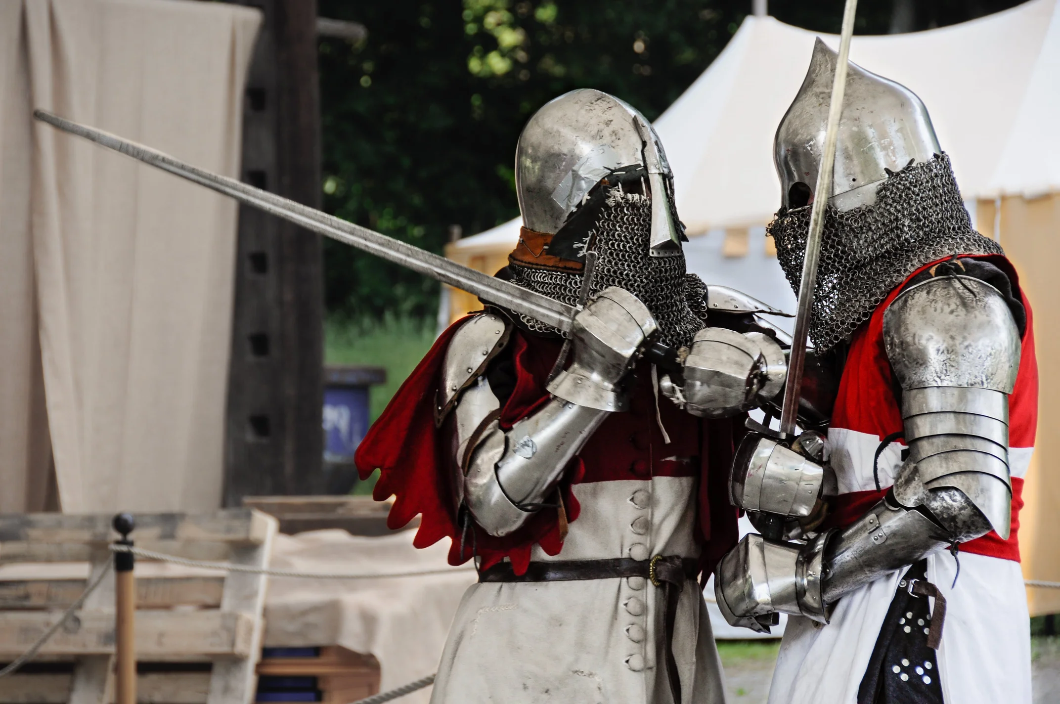 two people in armor holding swords